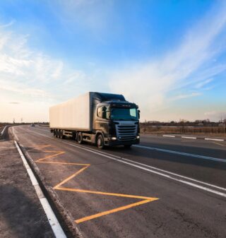 black-truck-moving-city-s-suburb